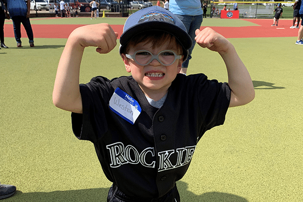 Photo of a healthy young athlete flexing their muscles