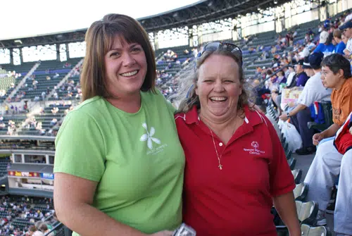 Forrest Phillips smiling with friend at a Special Olympics event