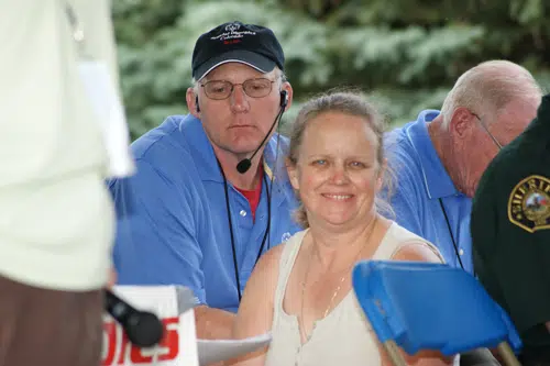 Forrest Phillips sitting at an event smiling