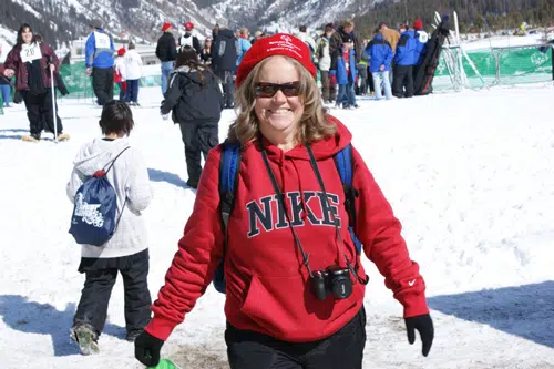 Forrest Phillips in Red Nike hoodie in the snow with camera